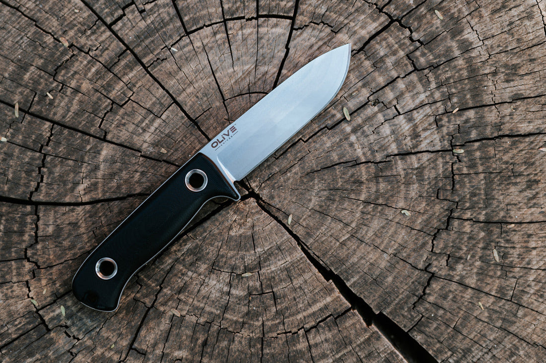 Close-up of a reliable fixed blade knife against a South Africa wilderness backdrop