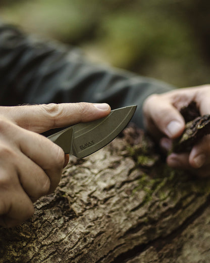 Olive Knives VENARI compact EDC fixed blade knife, Elmax steel — lifestyle, close-up bushcraft wood carving